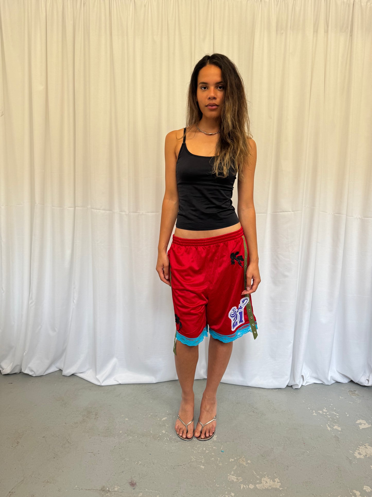 Red shorts with turquoise lace