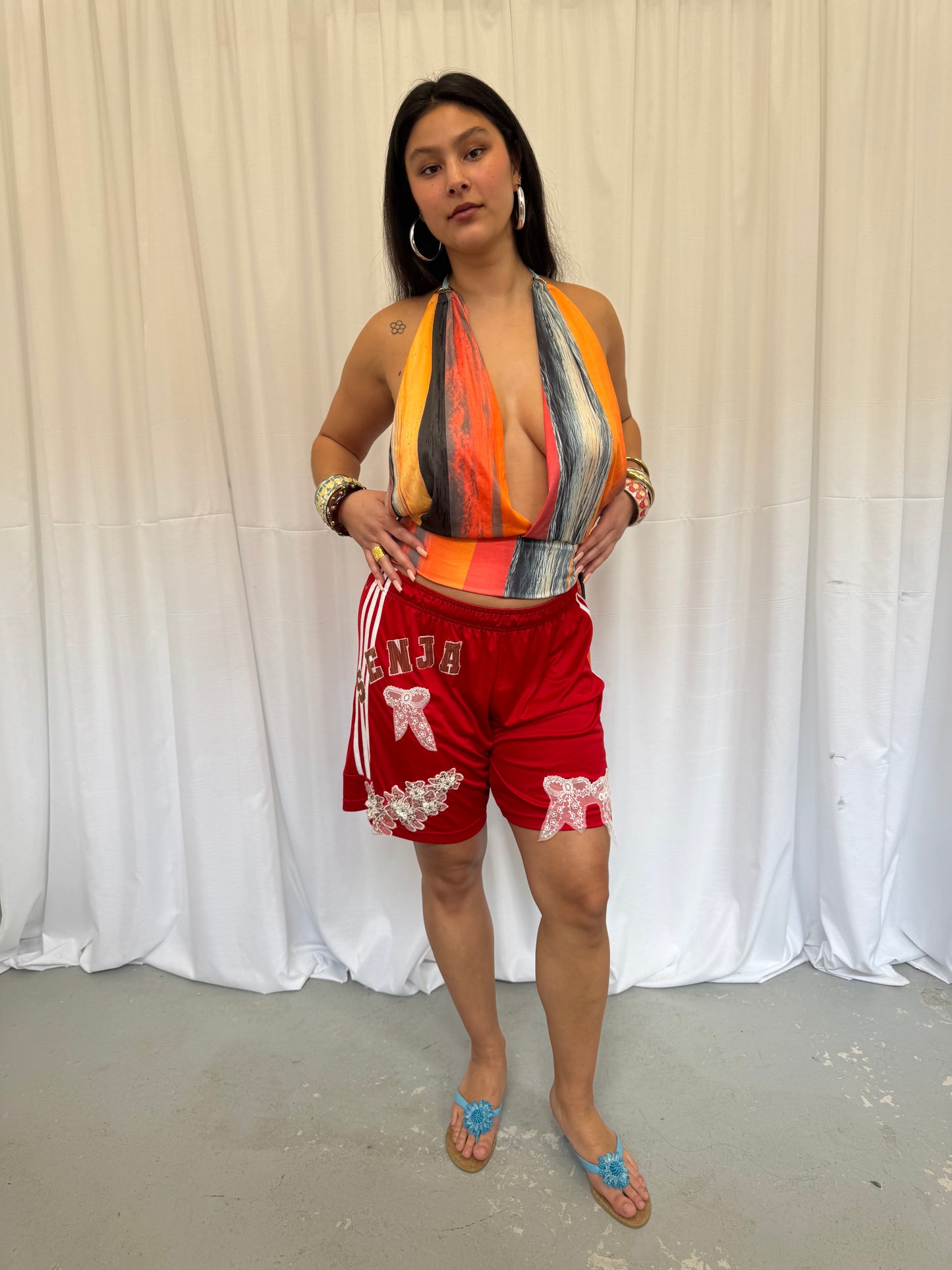 Red Shorts with Flower Embellishment