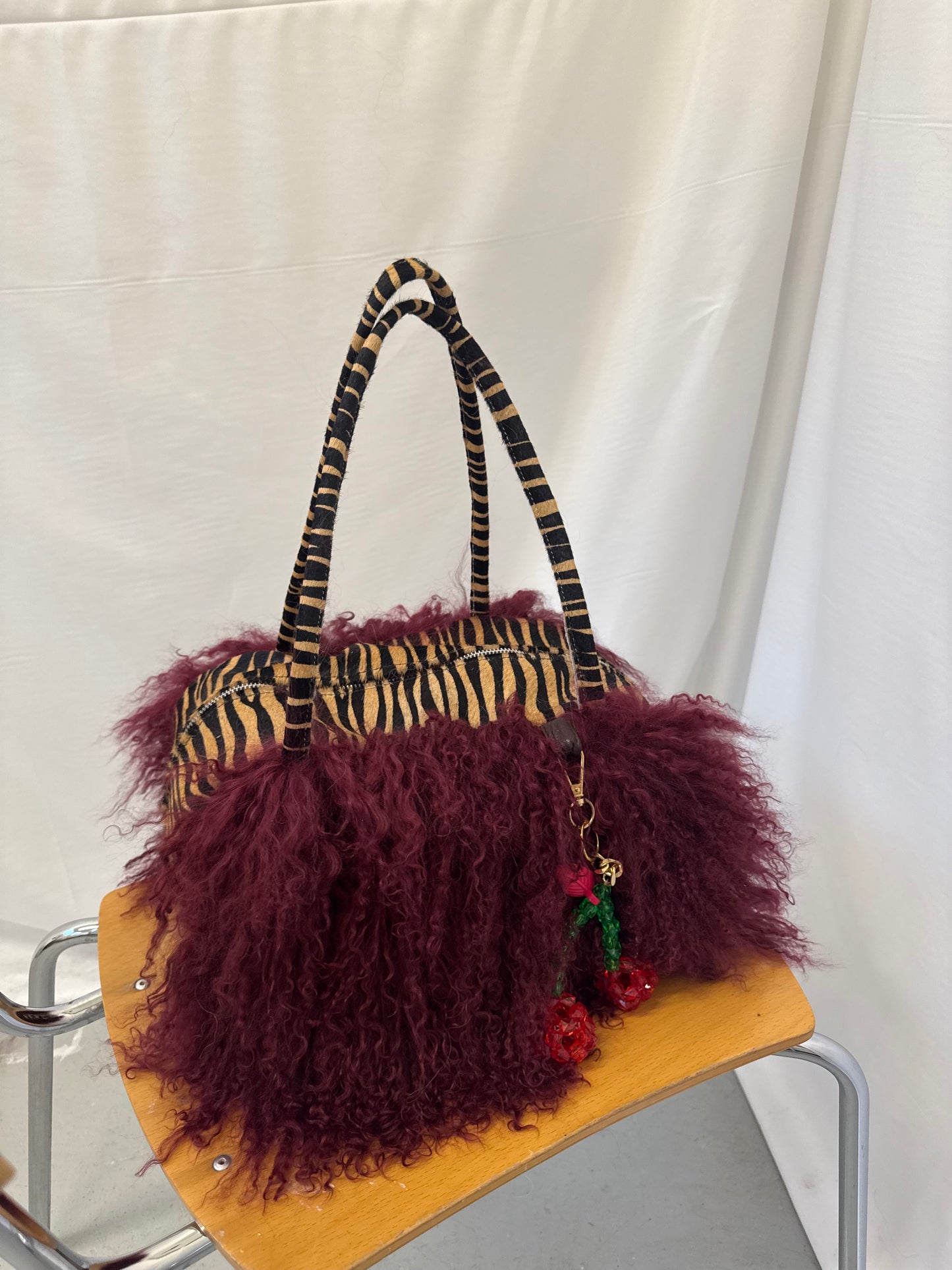 Burgundy Mongolian Wool Bowler Bag with Zebra Print Leather