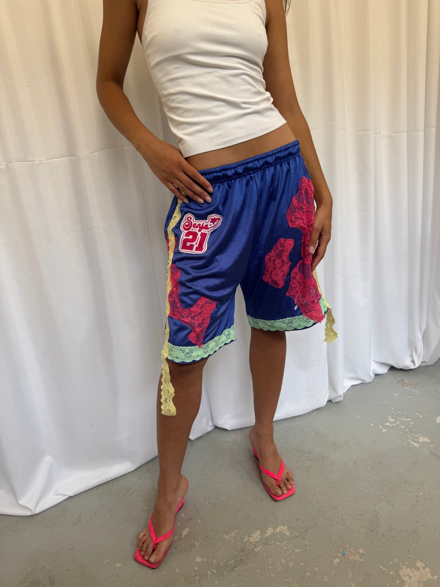 Blue shorts with pink and green lace