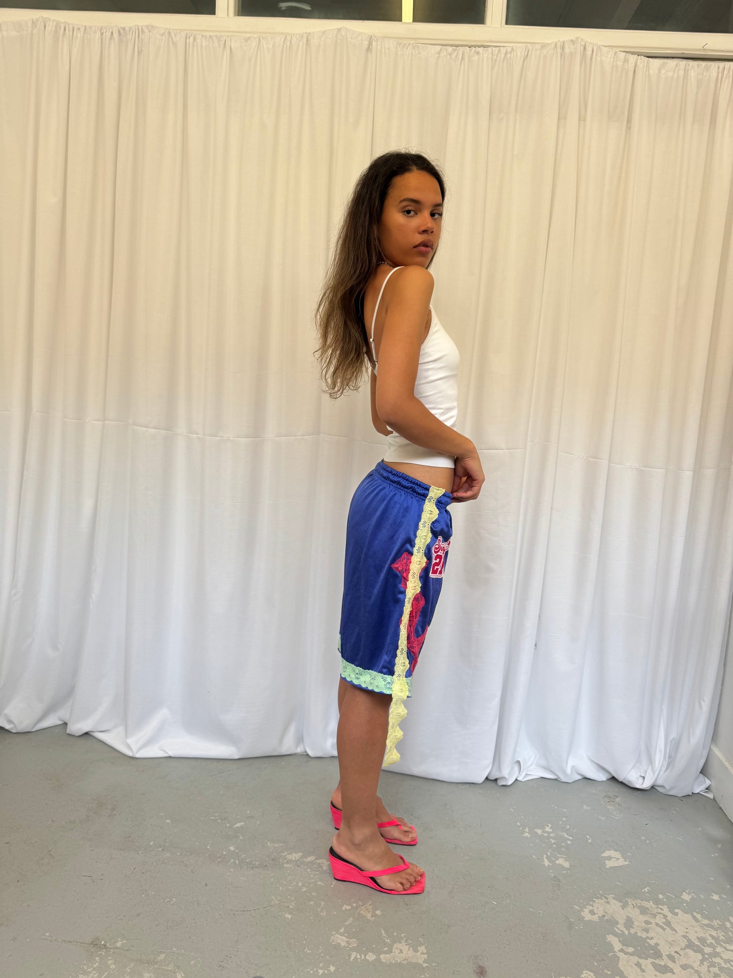 Blue shorts with pink and green lace