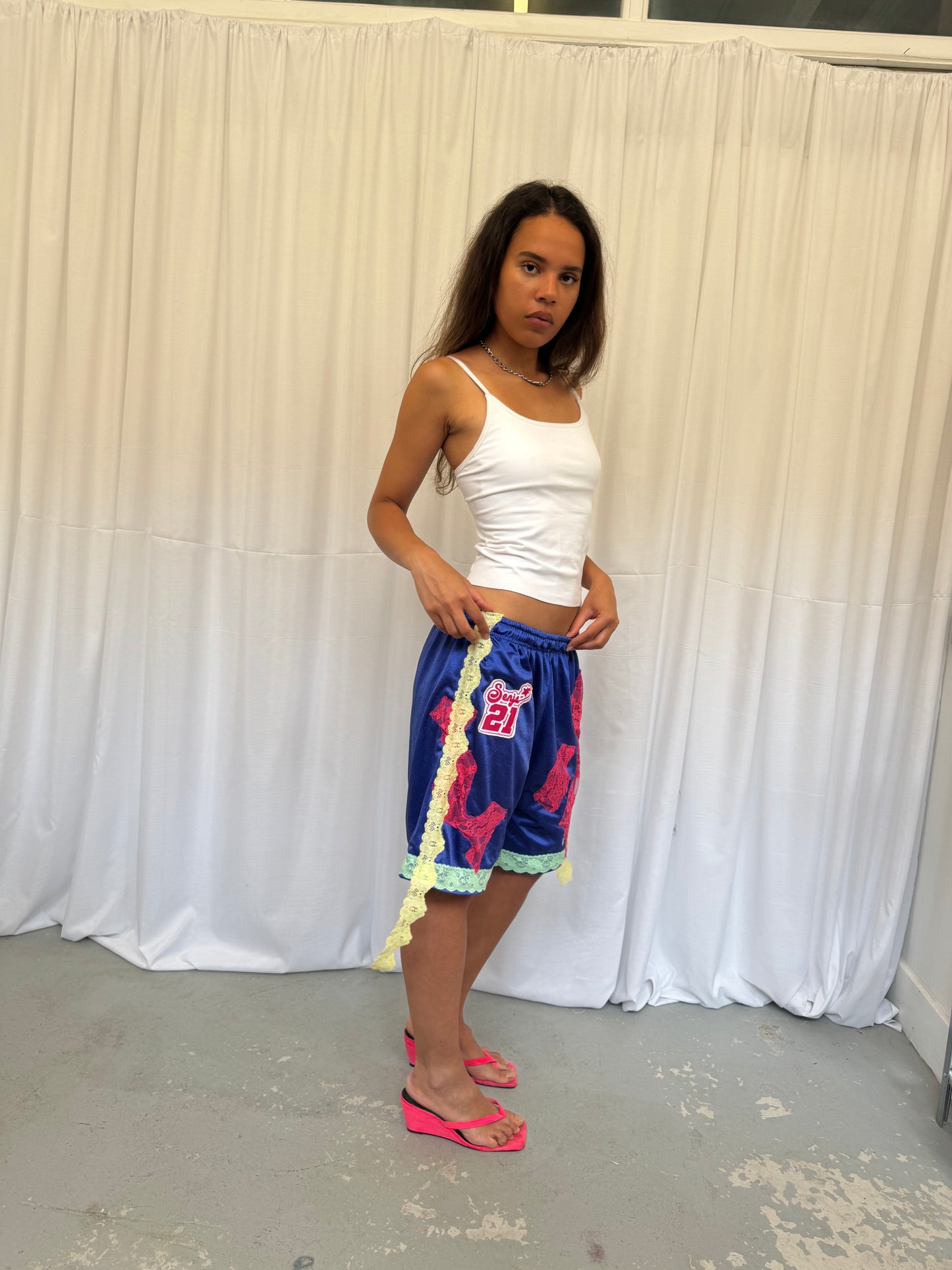 Blue shorts with pink and green lace