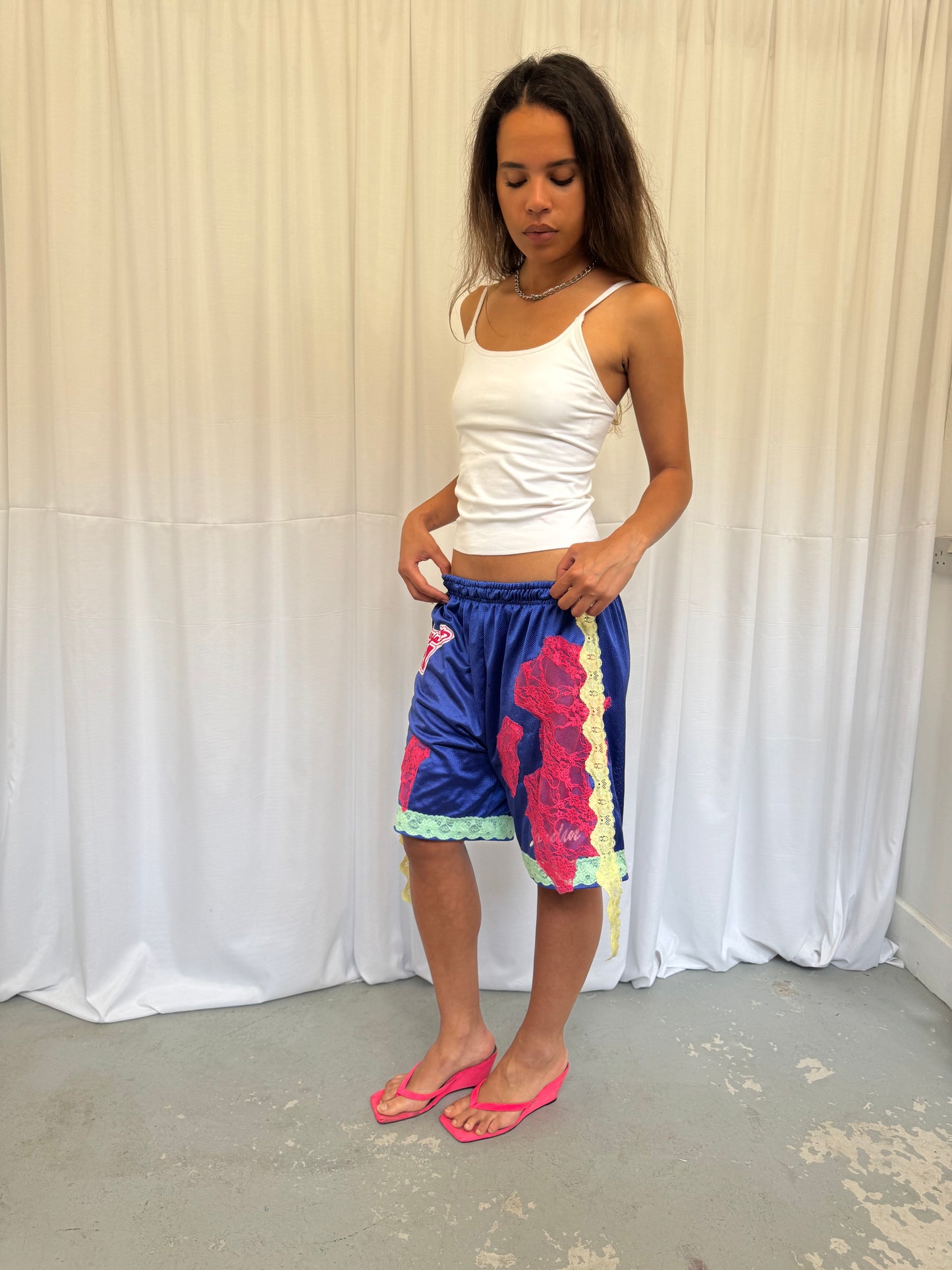 Blue shorts with pink and green lace