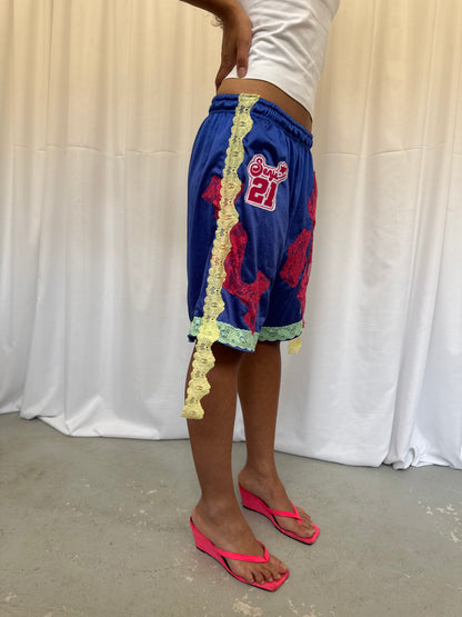 Blue shorts with pink and green lace