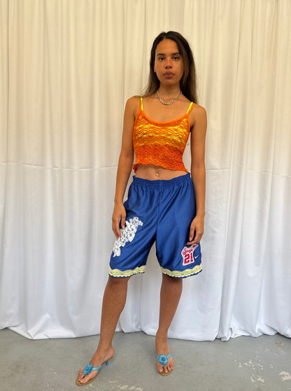 Blue shorts with yellow and white lace