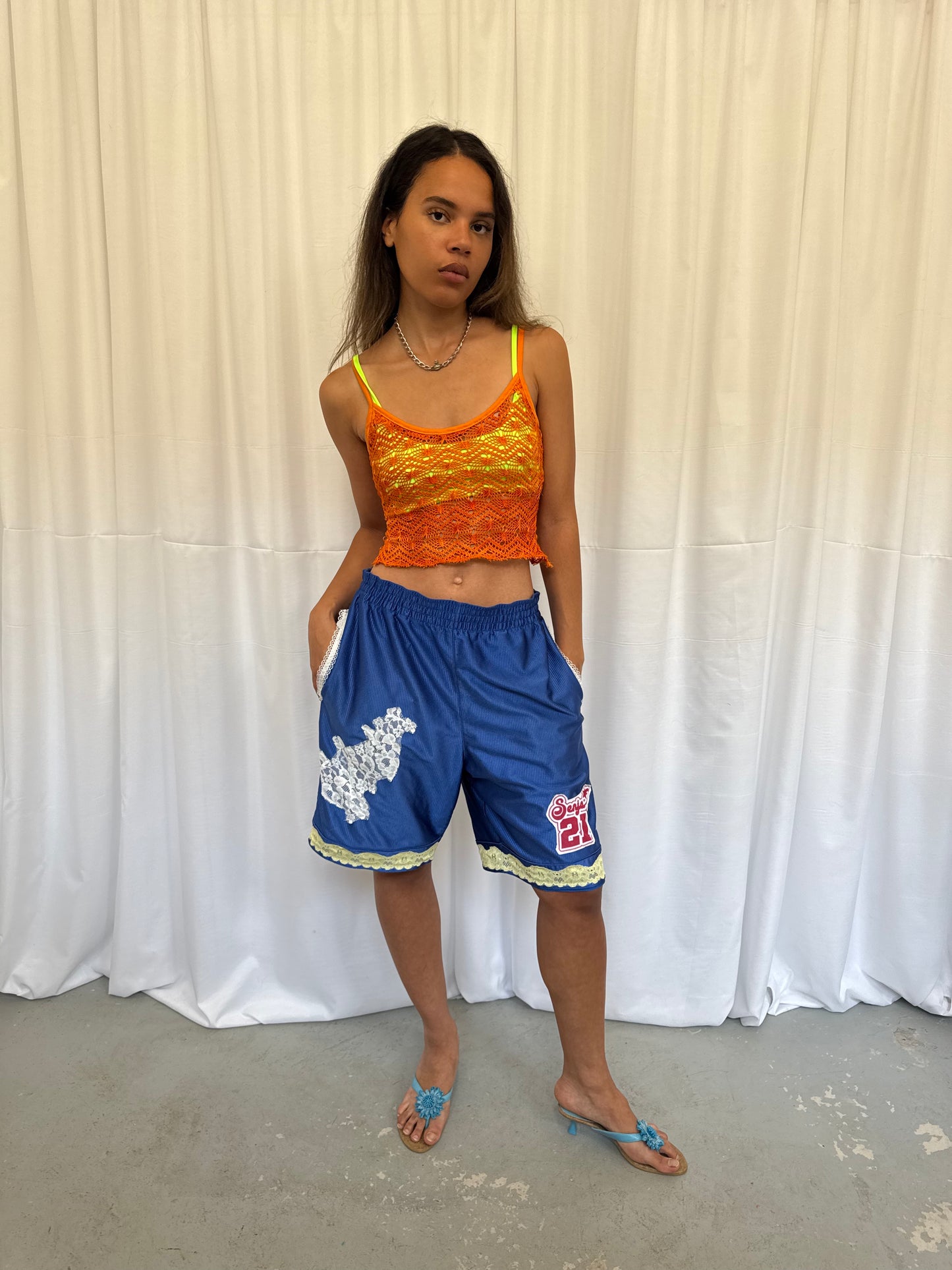 Blue shorts with yellow and white lace