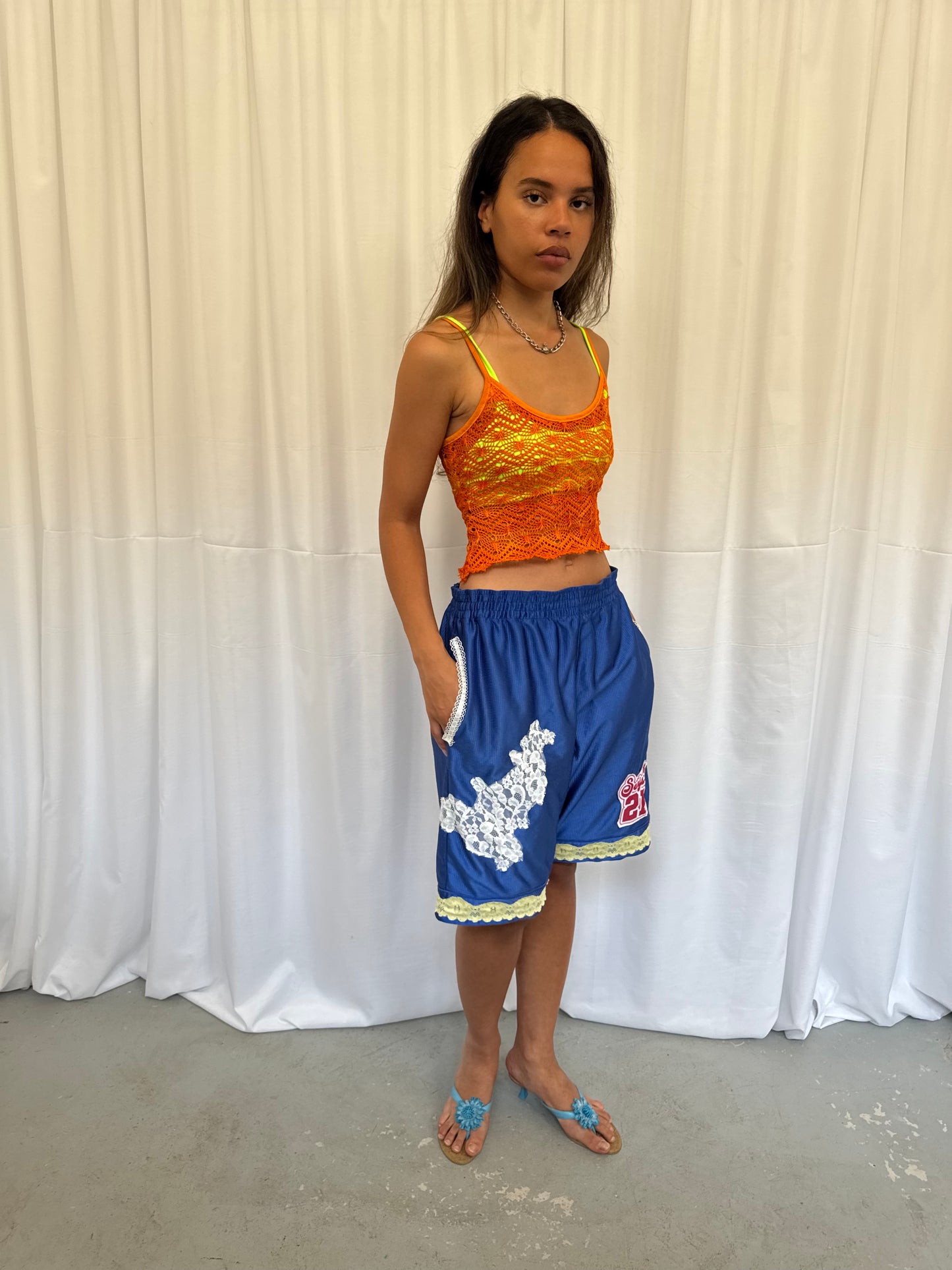Blue shorts with yellow and white lace