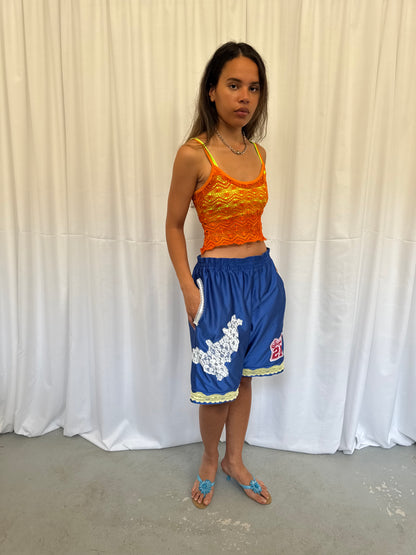 Blue shorts with yellow and white lace