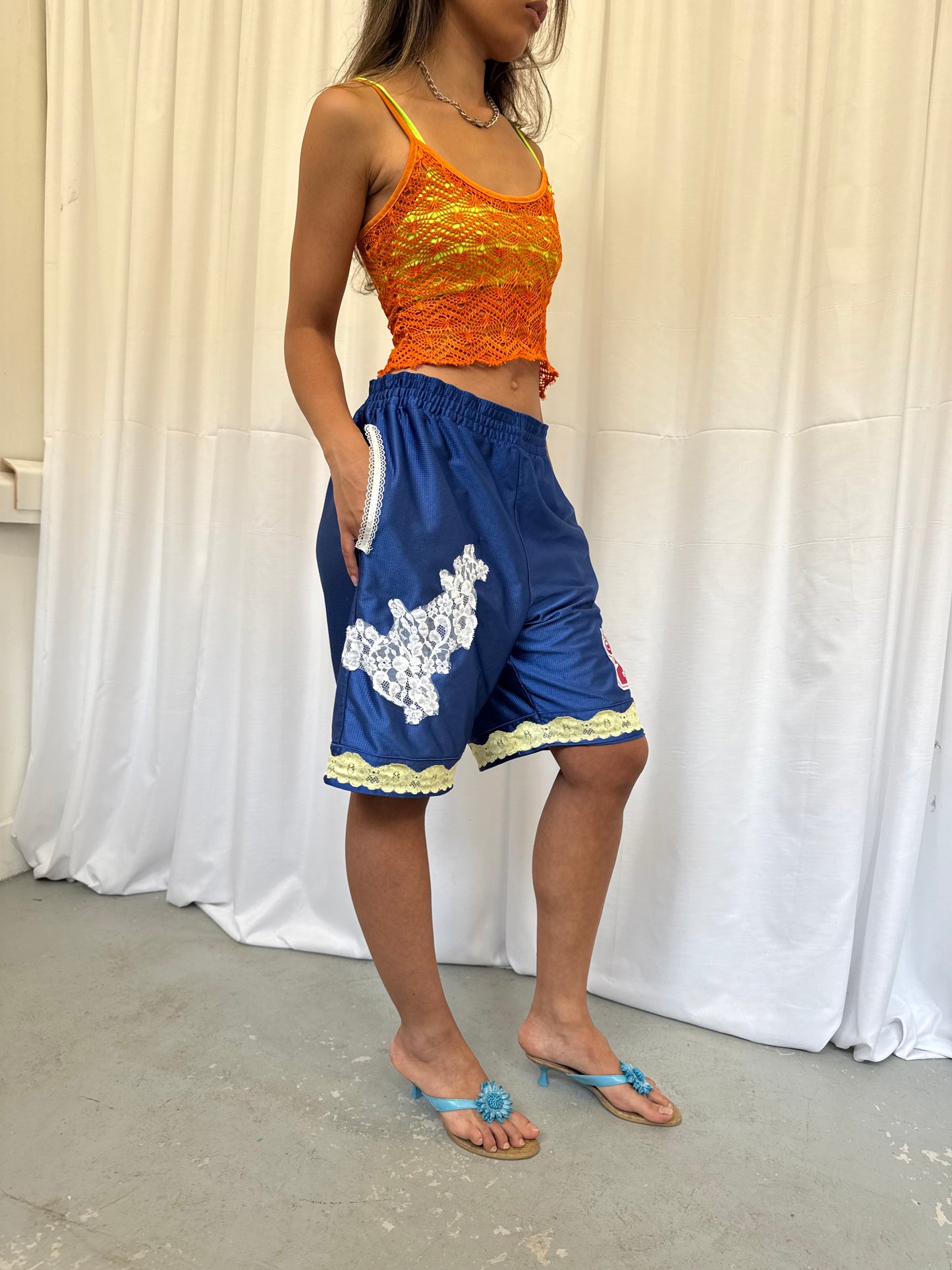 Blue shorts with yellow and white lace