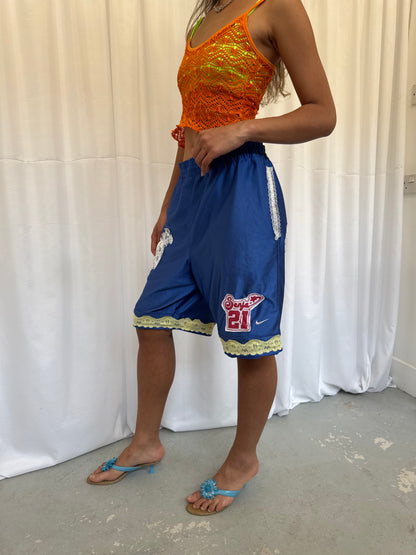 Blue shorts with yellow and white lace