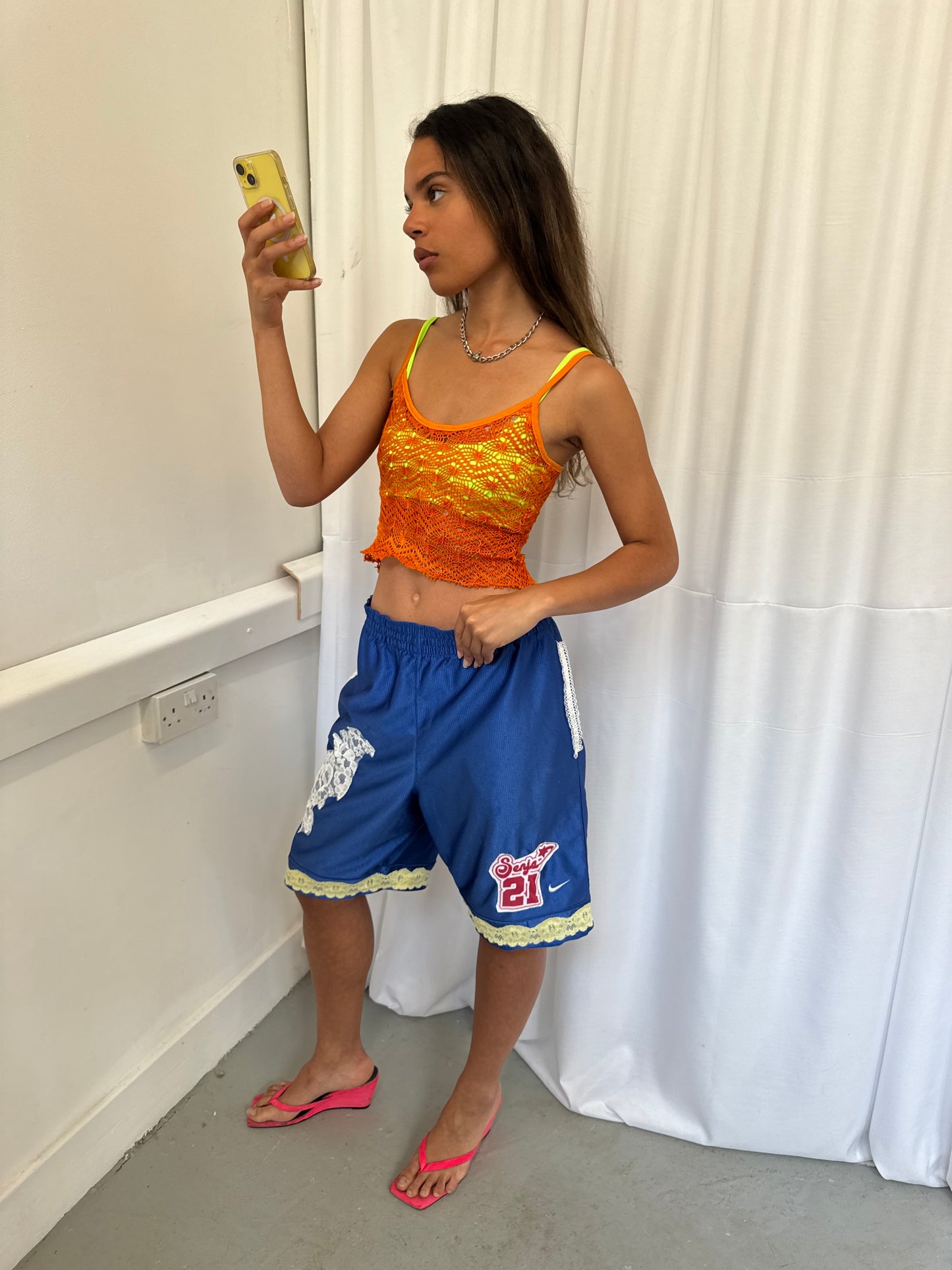 Blue shorts with yellow and white lace